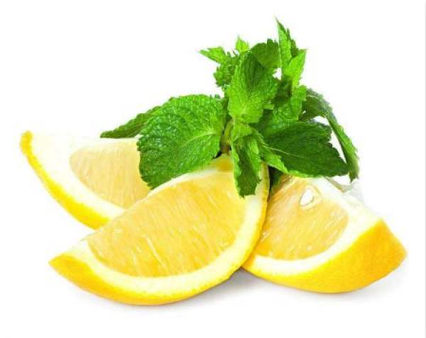 Lemon with green leaves