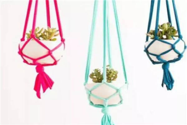 Flowerpots hung from old autumn clothes and trousers
